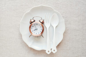 A clock on the plate, Intermittent fasting diet concept